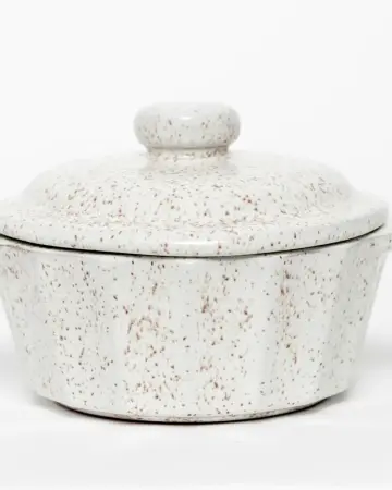 Speckled white ceramic jar with a lid